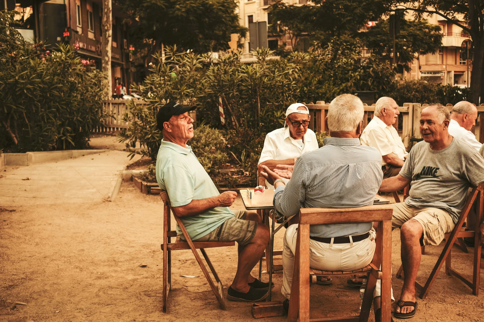 Retired people playing dominos on the beach